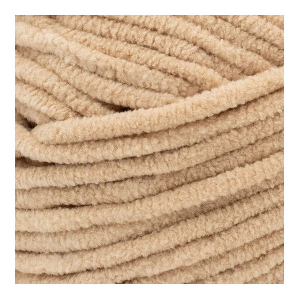 Close-up of beige textured yarn ball
