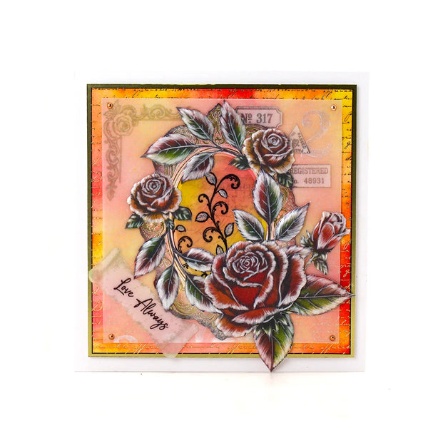 A square handmade greeting card featuring a vintage-style rose illustration with layered paper textures, a yellow sun motif, and a small translucent tag reading 'Love Always'.