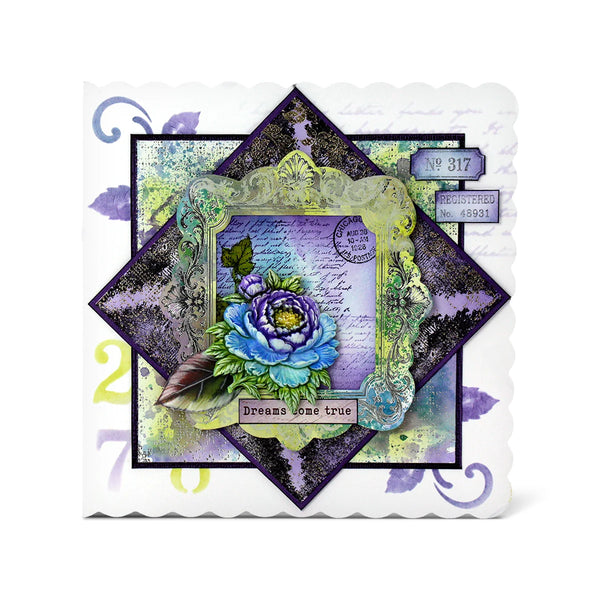 A square layered scrapbook card featuring a central diamond-shaped overlay with a blue and purple rose, vintage script, postage stamps, and decorative borders in purple, green, black, and white.