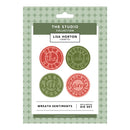 Lisa Horton Crafts 'Wreath Sentiments' mix and match die set by The Studio Collection, shown in its original packaging with four circular dies featuring holiday-themed sentiments.