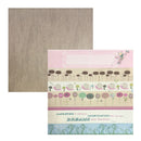 A square scrapbook paper sheet with a light brown woodgrain texture, shown overlapping a second sheet featuring a whimsical floral pattern with a pink header and decorative text.