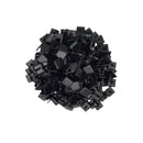 A pile of small black clips or fasteners, photographed from above on a plain white background.