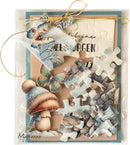 A packaged handmade card featuring a jigsaw puzzle with woodland-themed cutout pieces, including a mushroom in a knit hat, butterflies, and rustic text, tied with twine and sealed in clear plastic. The card is photographed on a white background.