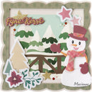 A festive handmade scrapbook card featuring a winter scene with a paper snowman wearing a plaid scarf and top hat, decorated pine trees, a wooden fence, and the words 'Fine Kerst' in glittery script. The card is framed by a scalloped olive-green border and has the brand name 'Marianne Design' in the bottom right corner.