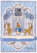 A layered Christmas card design featuring Peter Rabbit in the center, flanked by two gold deer figures, with a blue and white ornate frame and the text 'FJINE KERST' at the top. The card has a light blue patterned border and a visible 'Marianne design' signature in the lower right.