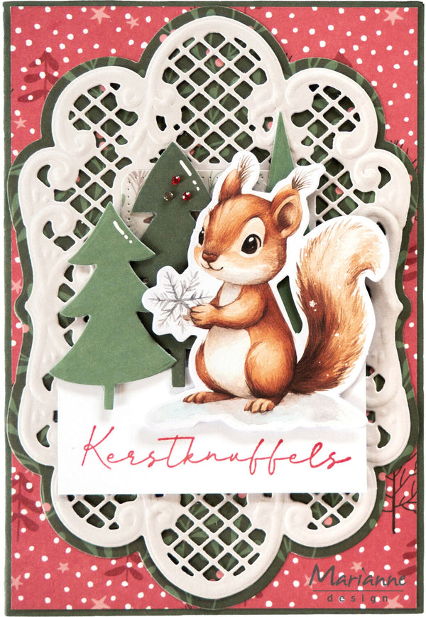 A handmade Christmas card featuring a detailed illustration of a brown and white squirrel holding a white snowflake, surrounded by layered white scalloped paper, green paper Christmas trees, and a red and white polka dot background. The text 'Kerstknuffels' is written in pink cursive at the bottom, and the brand 'Marianne Design' is visible in the lower right corner.