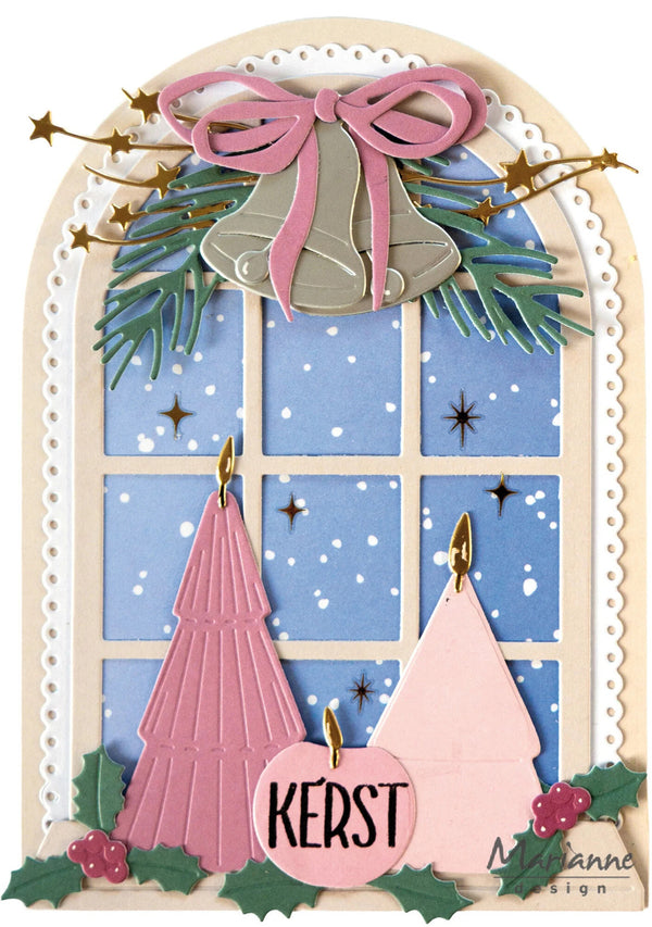 A festive Christmas window card design featuring two pink paper Christmas trees, silver bells with a pink bow, green pine branches, holly leaves, and a central pink ornament reading 'KERST' on a cream arched background.