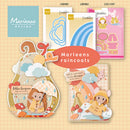 A collage showing several Marianne Design card designs themed around raincoats, with illustrated characters in yellow raincoats, clouds, mushrooms, and a central orange label reading 'Marleens raincoats.' Visible product cards include LR0981, LR0982, and COL1597.