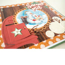 A close-up of a handmade Christmas-themed scrapbook page or card featuring a red snowman truck, a circular snowman illustration, glittery white circles, brown paper branches, and the text 'Snowman pret' on an orange and white patterned background.
