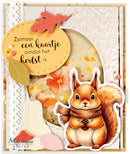 A handmade autumn-themed card featuring a die-cut illustration of a brown squirrel wearing a brown scarf, layered over floral and leaf embellishments, with a yellow tag containing Dutch text and the brand name 'Marianne design' in the lower left corner.