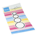 A craft die set by Mariannes Design for making four nested circles, shown on its branded retail backing card with pastel striped background.
