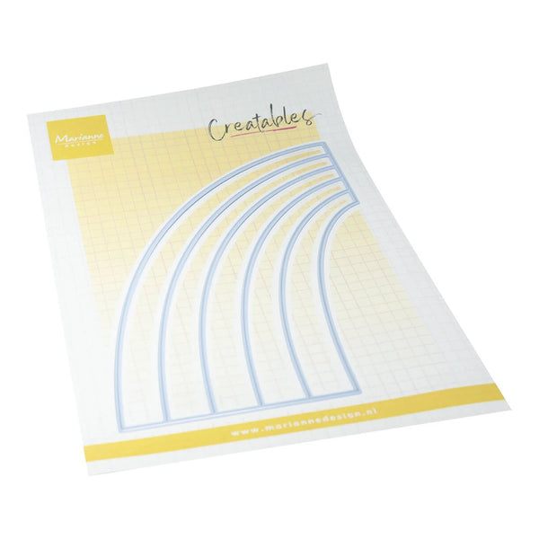 A sheet of white craft paper with a yellow grid background, featuring a set of five arch-shaped metal dies outlined in blue. The sheet has a yellow brand label in the top-left corner reading 'Marien Design' and the word 'Creatables' written in script near the top center.