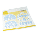 A sheet of Marianna Design Creatables scrapbooking paper featuring four light blue embossed floral and scroll cutout designs on a white grid background with yellow accents.