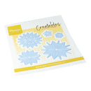 Marianne Design Creatables die-cut sticker set featuring four light blue snowflake designs on a white and yellow grid backing card.