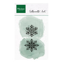 Marianne Design Silhouette Art sheet featuring two black snowflake cutout designs over pale mint green watercolor washes on a white background.