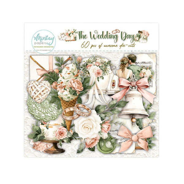 A sheet of wedding-themed scrapbook or craft stickers titled 'The Wedding Day' by Montay Papers. The design features a collection of bridal elements including a white wedding dress, pink and white roses, rings, a heart-shaped lace veil, a bell, and a teapot, all arranged on a vintage-style background.