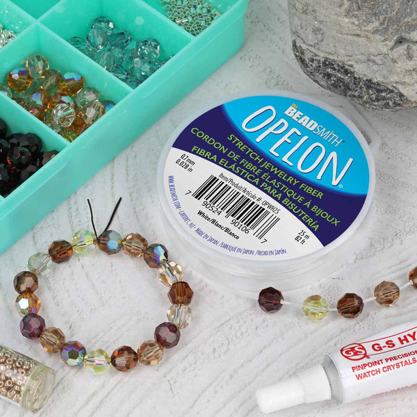 Beaded bracelet with Opelon stretch jewelry fiber on a textured surface