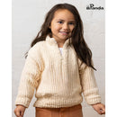 Young girl wearing a beige sweater against a white brick wall, with Panda brand logo.