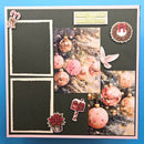 A square scrapbook or photo-booking layout with a dark charcoal background, pink border, and collage elements including Christmas ornaments, candy canes, a dove, a wreath, a small plant, and two photo frames on the left side.
