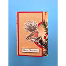 A handmade Christmas greeting card featuring a textured beige background, a red border, a robin bird, pine branches, and a 'Merry Christmas' label, displayed against a solid blue background.