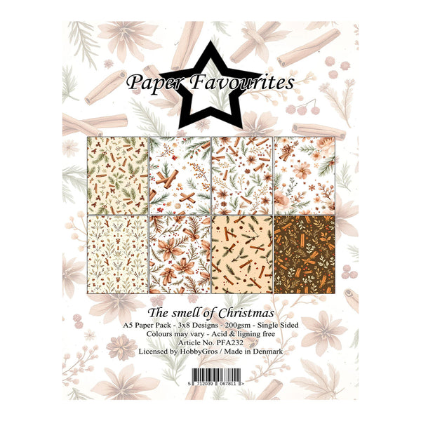 Paper Favourites 'The smell of Christmas' A5 paper pack featuring a 3x3 grid of 358 holiday-themed patterned designs. The pack includes designs with cinnamon sticks, pinecones, gingerbread men, ornaments, and winter foliage on cream, beige, and brown backgrounds.