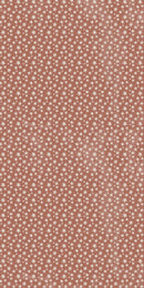 A close-up of a terracotta or dusty rose fabric patterned with a dense, repeating white star print.