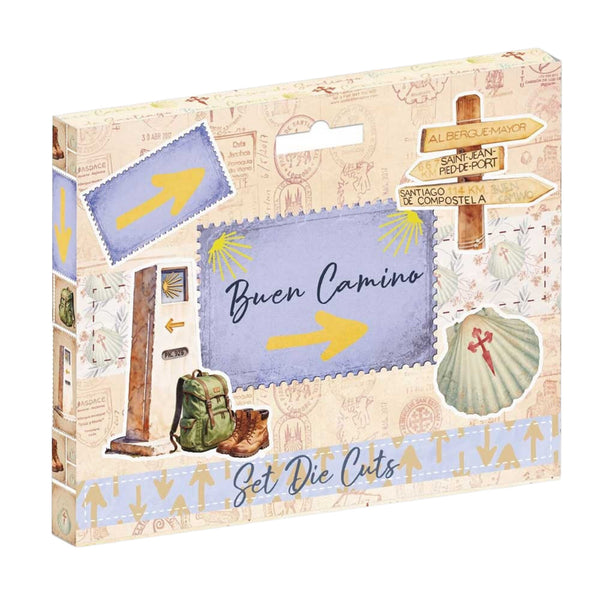 A boxed craft kit labeled 'Set Die Cuts' with a travel-themed design. The package shows illustrated postcards, directional signs, a backpack, boots, and a shell with a cross, on a light beige background.