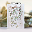 A handmade greeting card by Penny Black featuring a 3D layered mistletoe design with green and white leaves, a twine bow, and gold foil script reading 'Rejoice' on a white cardstock background.