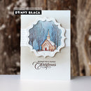 A handmade greeting card by Penny Black featuring a die-cut scalloped frame around a winter church scene with bare trees and a blue sky. The card has a textured white band across the middle and the words 'Wishing You a Blessed Christmas' in black script at the bottom.