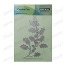 Penny Black Creative Dies 100% Steel Cutting Die featuring a holly branch design, shown in its original green packaging with a silver metal die visible.