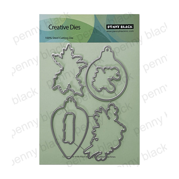 Penny Black Creative Dies steel cutting die set featuring four ornament-shaped metal dies on a light green backing card.