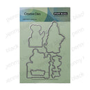 Penny Black Creative Dies set featuring four steel cutting dies in holiday tree and snowman shapes, presented on a light green backing card.