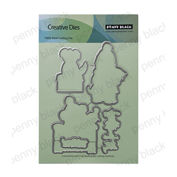 Penny Black Creative Dies set featuring four steel cutting dies in holiday tree and snowman shapes, presented on a light green backing card.