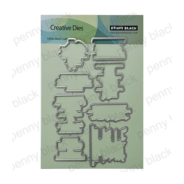 Penny Black Creative Dies steel cutting die set in its original packaging, featuring multiple metal die shapes on a light green card.
