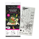 Sock Paper Scissors Christmas Series stamp set by Pink Ink Designs, showing the retail packaging on the left and the clear stamp sheet on the right with black line-art designs including scissors, socks, and a mouse.