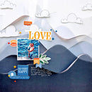 Scrapbook layout with mountains, clouds, and a couple photo, featuring the word 'LOVE'.