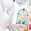 Collage of decorative paper cutouts including a fairy, door, and floral elements on a light background.