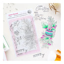 Festive Flourish clear stamp set by Pink Peony Studio, featuring Christmas-themed phrases and a holly ornament stamp, displayed on a white background with a pink ink pad and sample stamped designs.