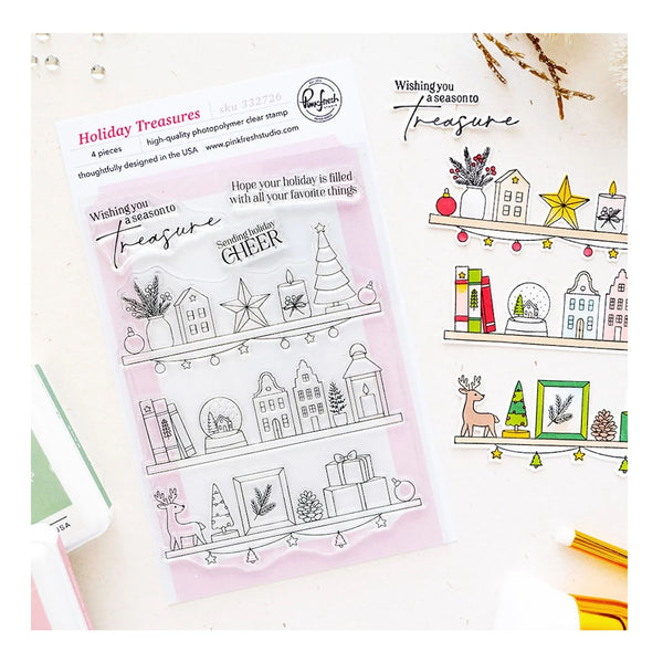 A clear stamp sheet and matching stamped holiday-themed designs displayed on a light surface. The stamp packaging reads 'Holiday Treasures' and shows line-art illustrations of houses, stars, trees, gifts, and decorative motifs.