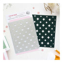 A flat-lay product photo of a quilting die set by Bella+Canvas, titled 'Celestial Quilt'. The set includes a steel-cutting die with star-shaped cutouts on a gray sheet, its pink and white packaging card, and a dark green fabric sample showing the star cutout pattern.