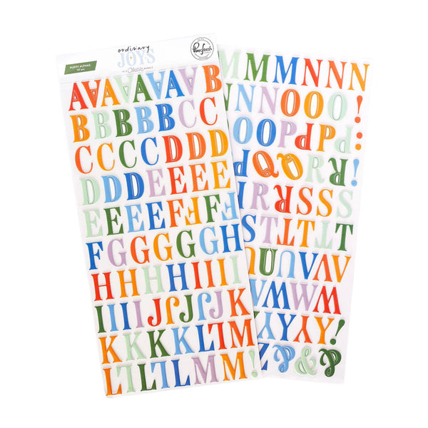 Two sheets of colorful alphabet stickers with playful hand-drawn lettering in multiple pastel and bright colors, shown on a plain white background.