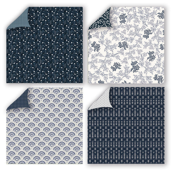 Four square fabric or paper swatches arranged in a 2x2 grid, each showing a different navy-and-white pattern with one corner peeled back to reveal the reverse side. The patterns include small white motifs on navy, blue floral vines on white, repeating scallop/扇 shapes on white, and vertical floral motifs on navy.