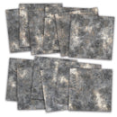 Twelve square sheets of textured gray and beige patterned paper, arranged in two overlapping stacks on a white background.