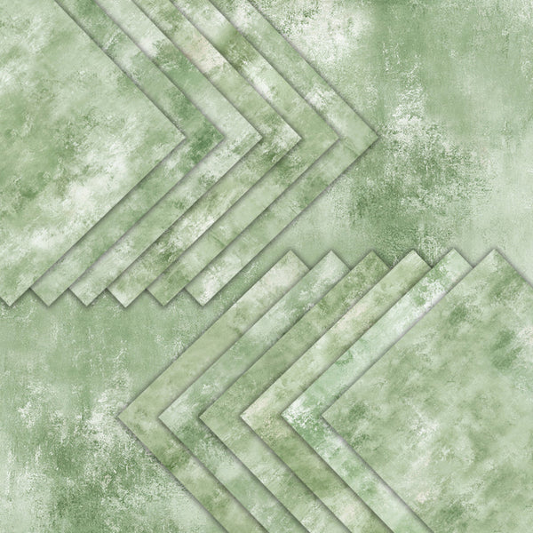 A green and white textured geometric pattern featuring layered chevron and diagonal rectangular shapes with a distressed, mottled finish.