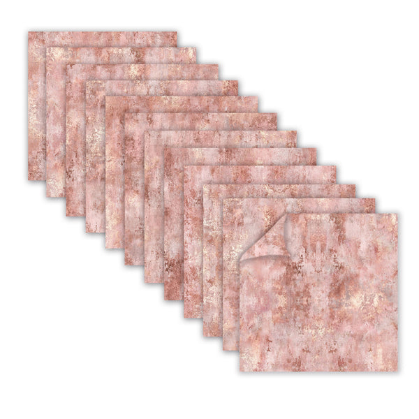 A set of square napkins with a distressed rose gold and pink marble pattern, arranged in a diagonal stack on a white background.