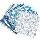 A stack of patterned paper napkins or placemats fanned out on a white background, featuring various blue ocean-themed illustrations including seashells, starfish, waves, and fish.