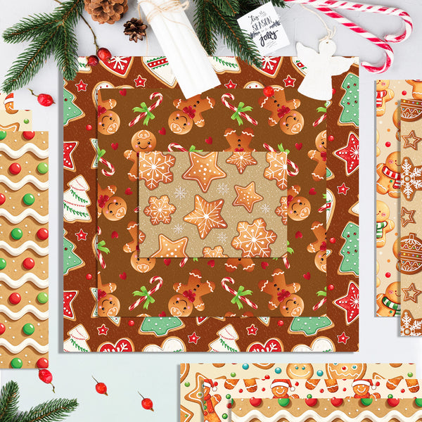 A flat lay of Christmas-themed patterned papers with gingerbread cookies, candy canes, ornaments, evergreen branches, and holiday decorations on a light background.