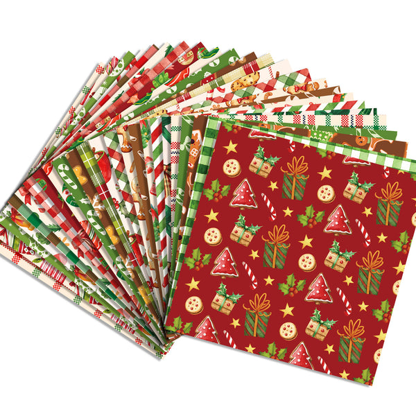 A fan of Christmas-themed patterned paper napkins or fabric squares on a white background, featuring festive designs like wrapped gifts, candy canes, ornaments, stars, and holiday greens and reds.