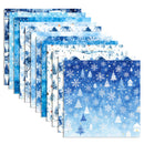 A set of layered square paper sheets with winter-themed patterns, including snowflakes, snow-covered trees, houses, and snowy landscapes in shades of blue and white.