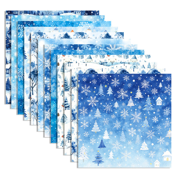 A set of layered square paper sheets with winter-themed patterns, including snowflakes, snow-covered trees, houses, and snowy landscapes in shades of blue and white.